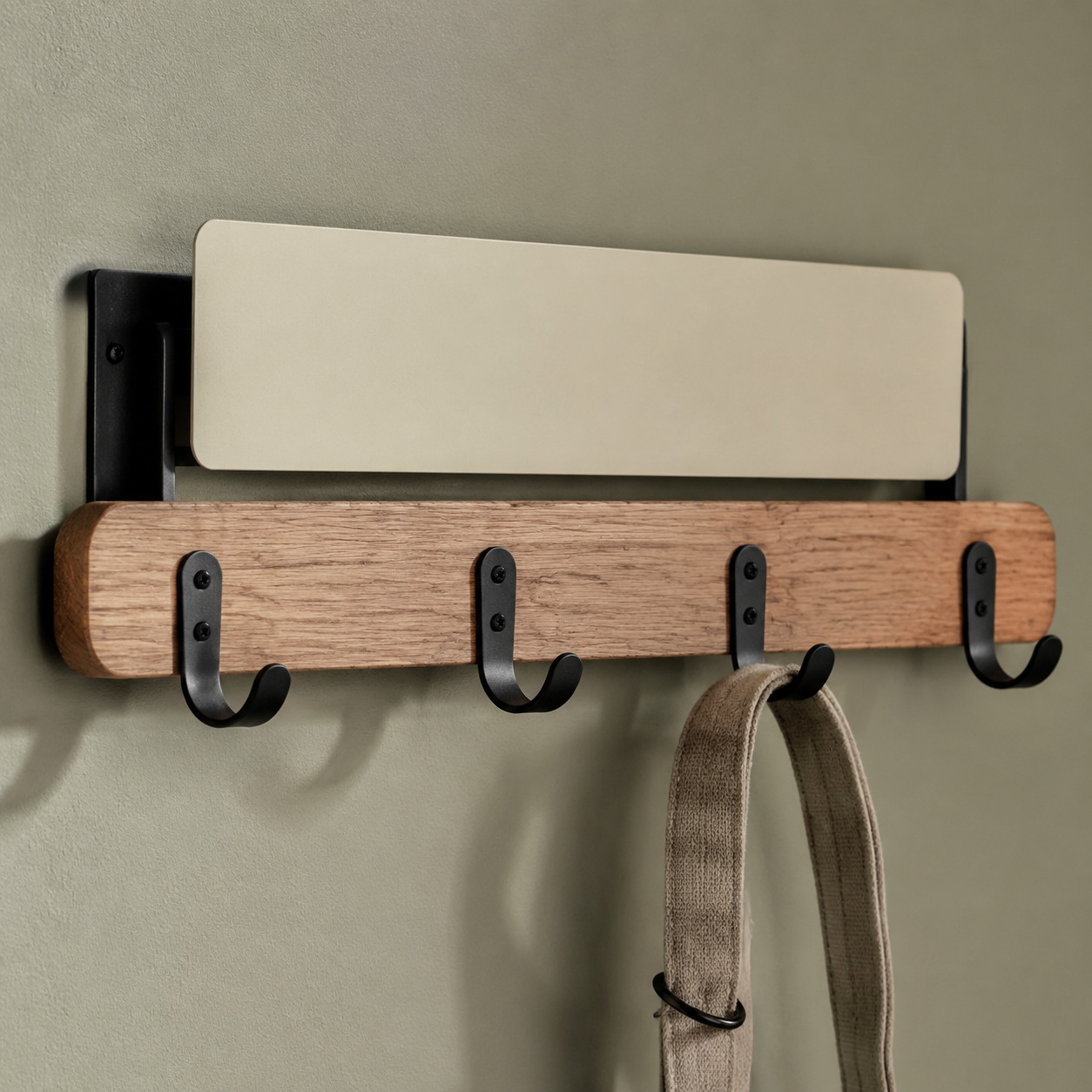 Utility Lead Rail close-up: black wall hooks mounted on a timber rail with a cream label board and a plain lead hanging.